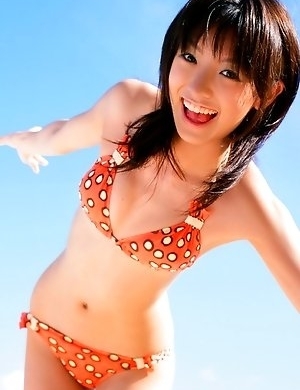 Akina Minami in colorful bath suits plays with big ball