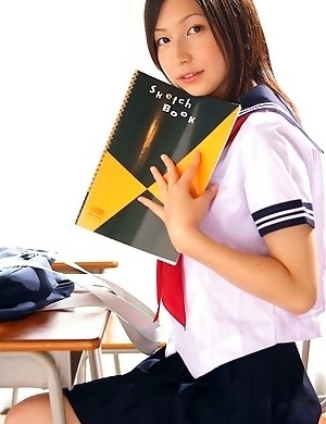 Kaori Ishii is naughty and shows legs under uniform skirt